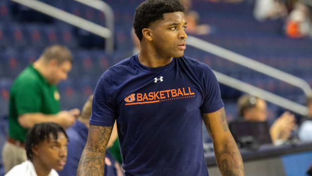 KD Johnson in warm ups before the Auburn basketball season opener against George Mason.